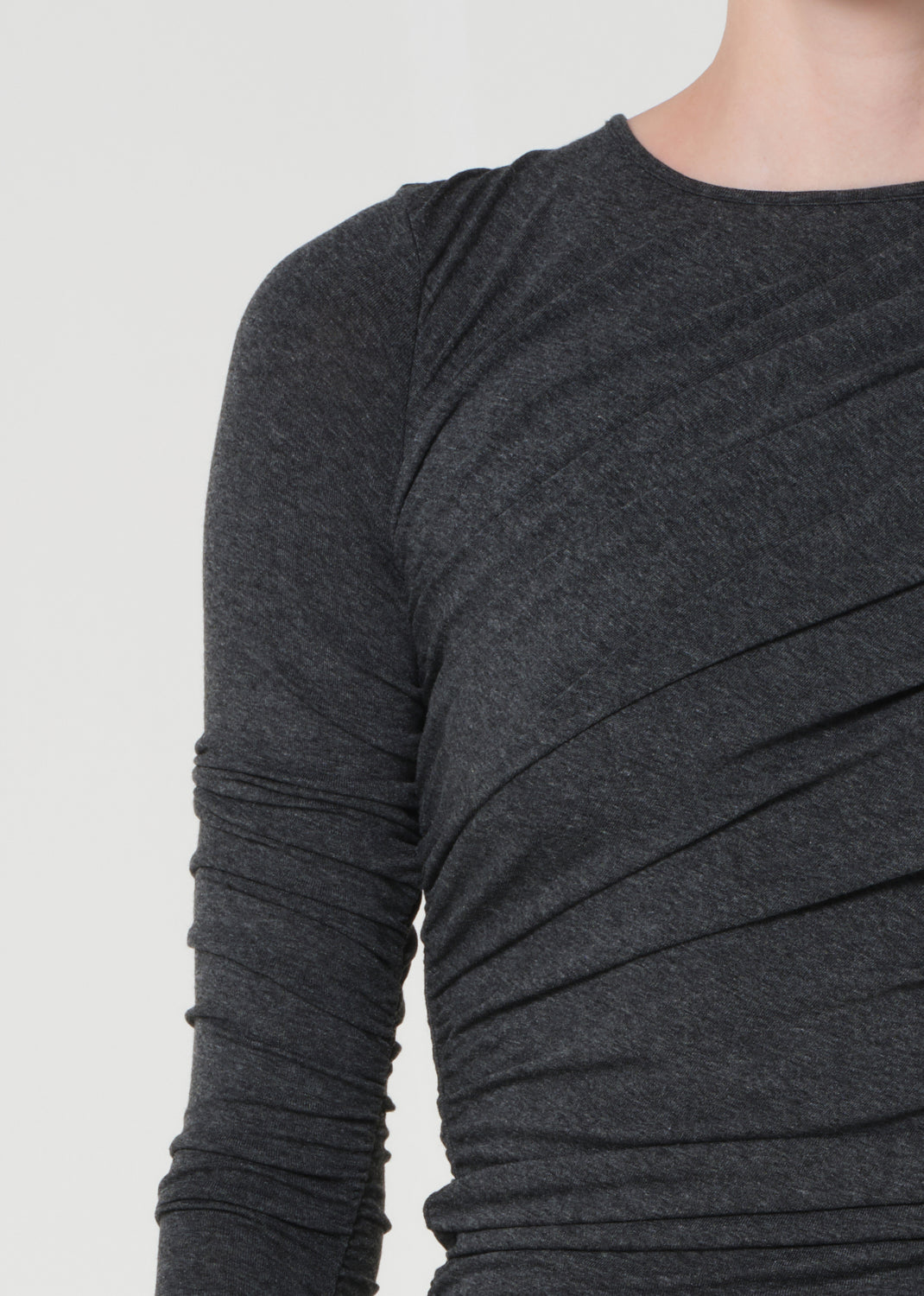 Dark gray long-sleeve top on a plain background
