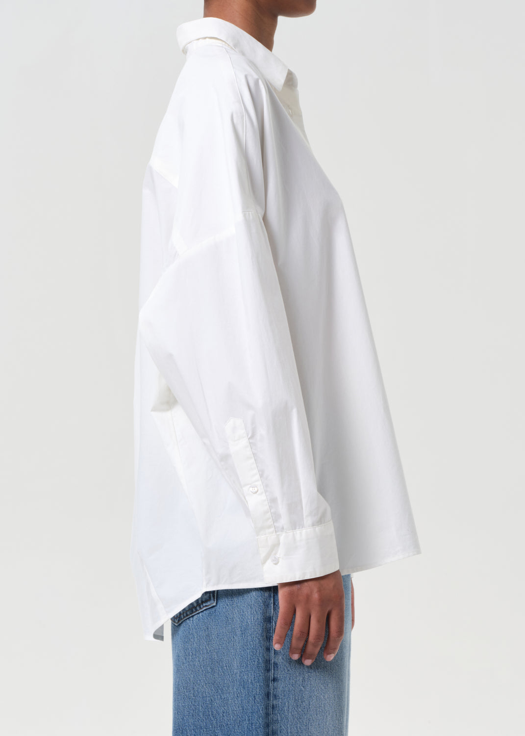 White shirt worn by a person on a white background