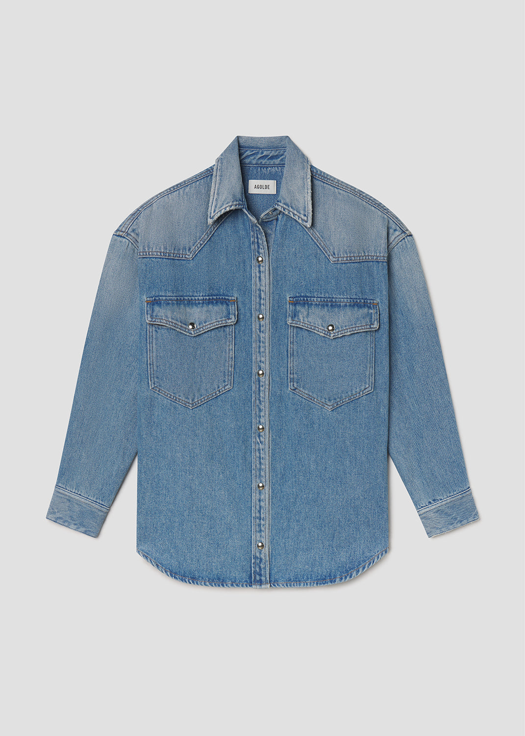 Blue denim shirt on a light gray background