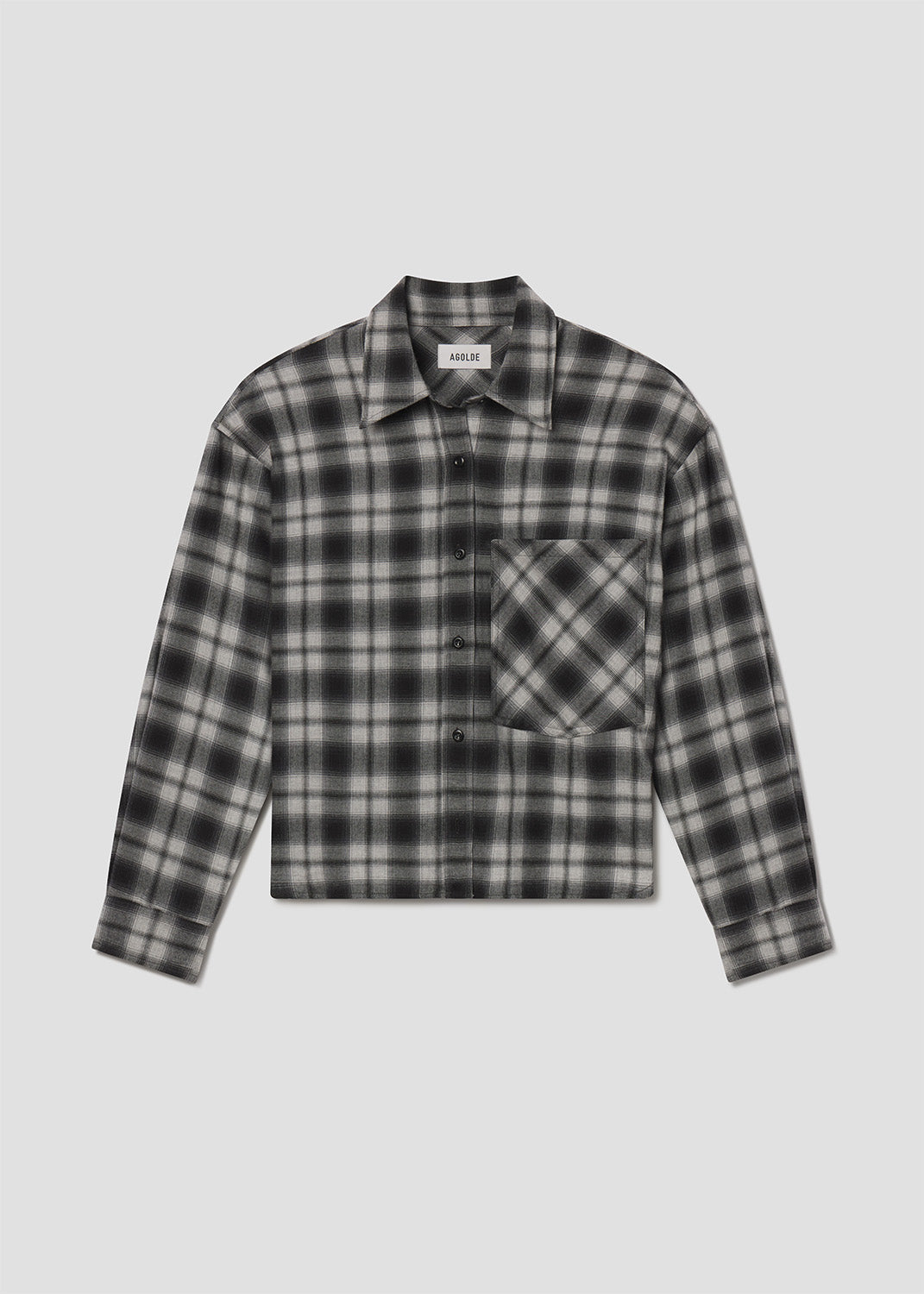 Plaid shirt with a pocket on a light gray background