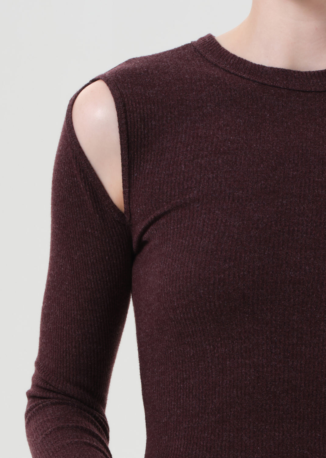 Brown sweater with cut-out shoulders on a white background