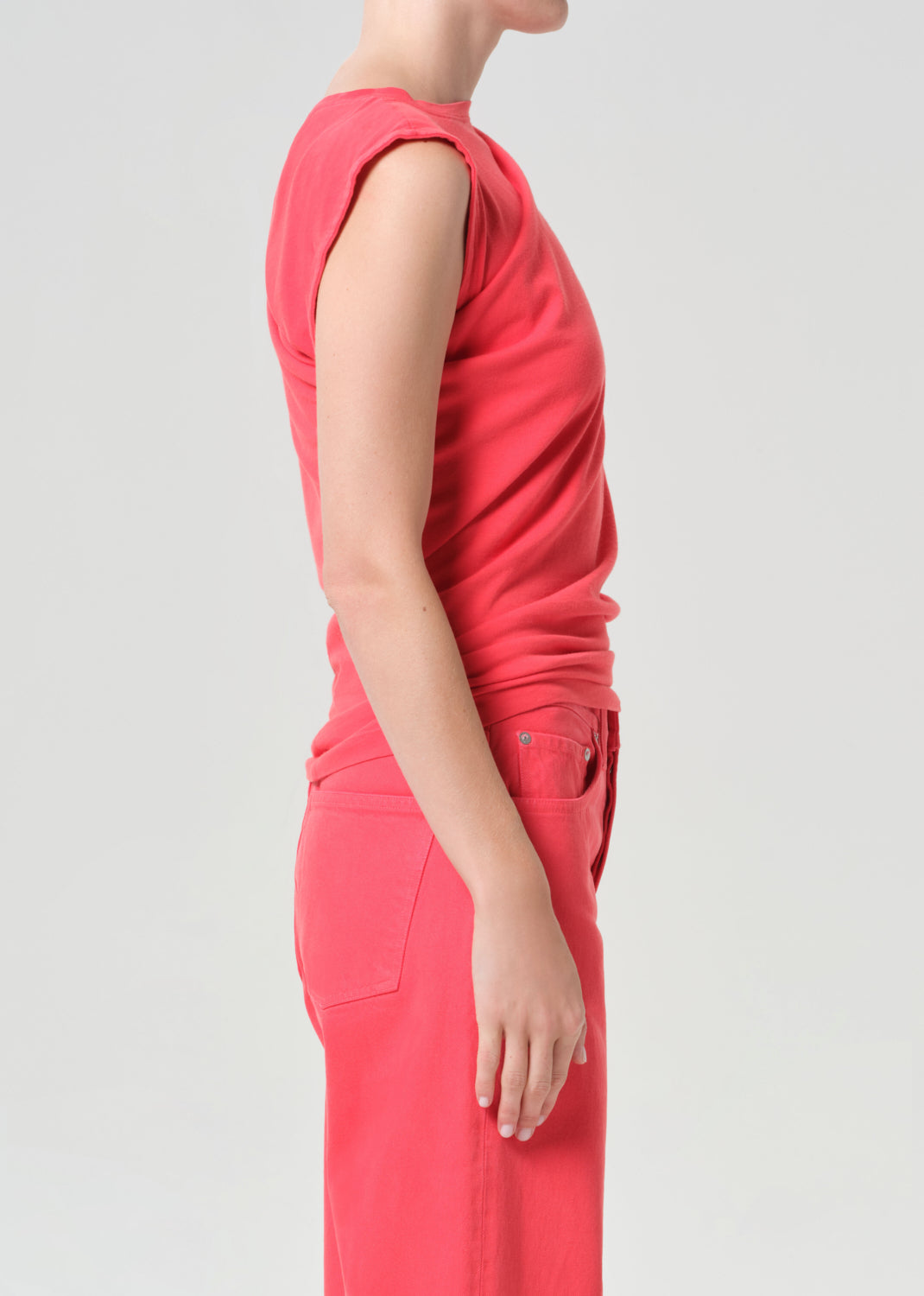 Person wearing a red outfit on a plain background