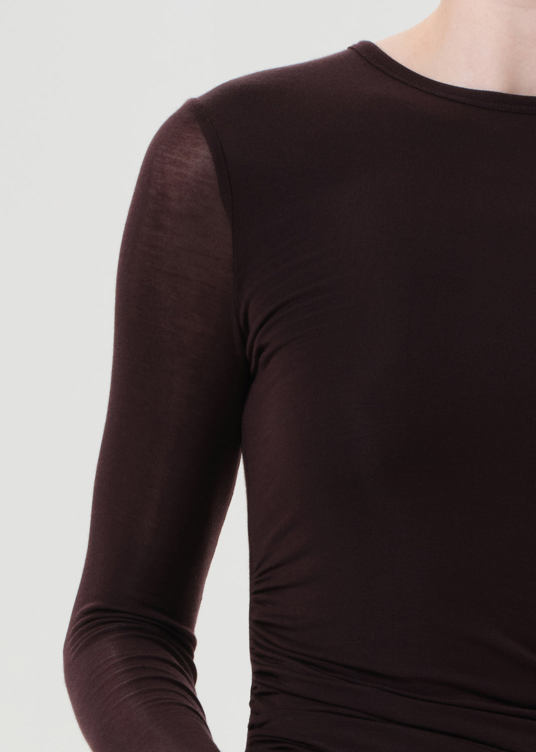 Brown long-sleeve top on a white background