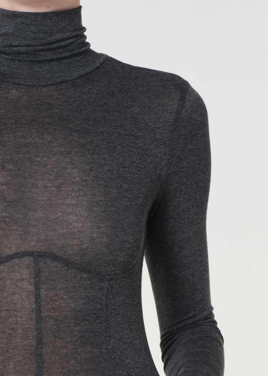 Dark gray turtleneck sweater on a plain background