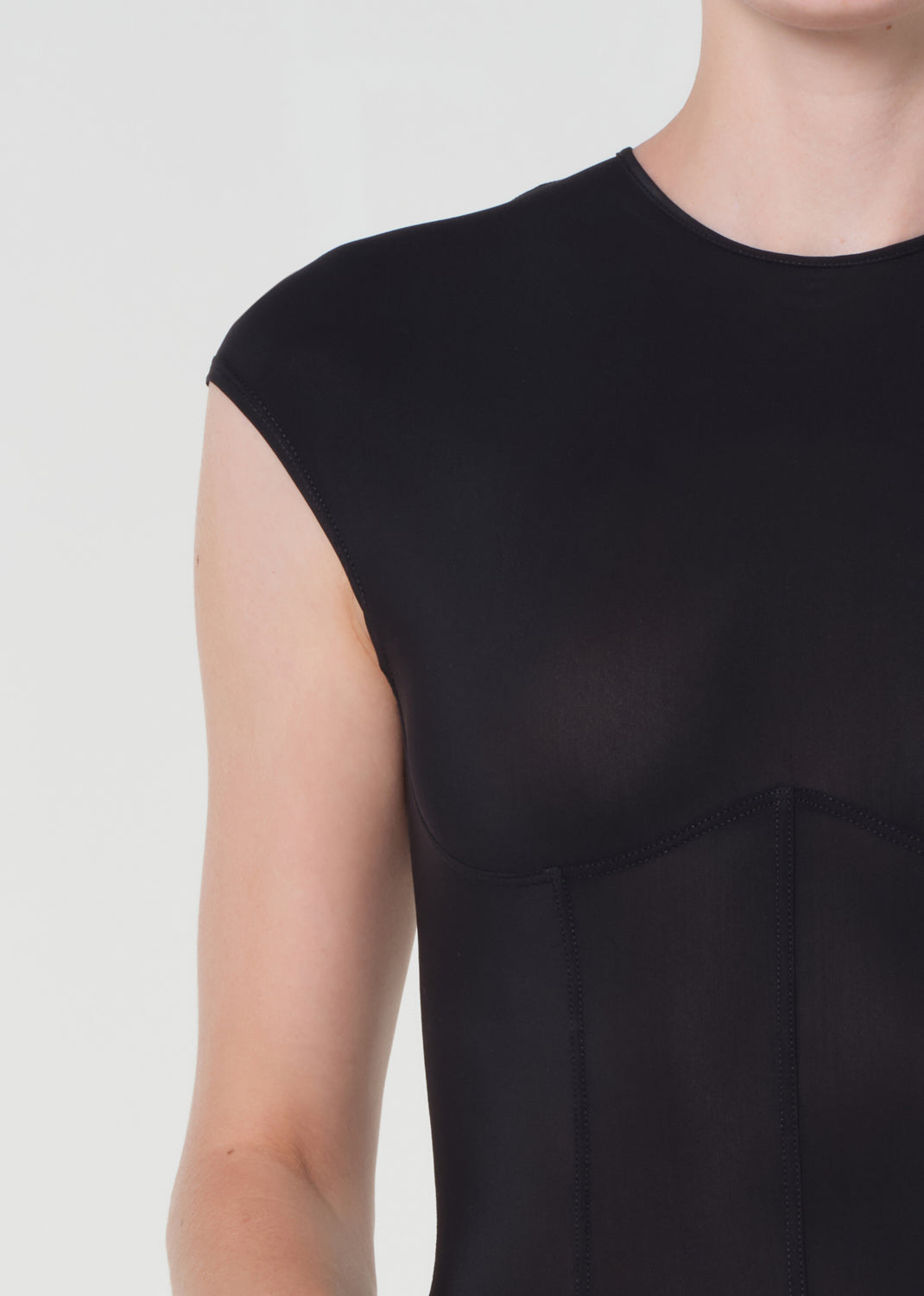 Black sleeveless dress on a plain background