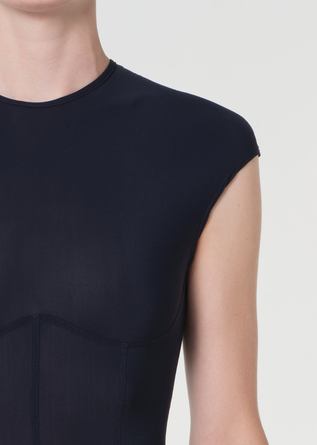 Navy blue sleeveless dress on a plain background