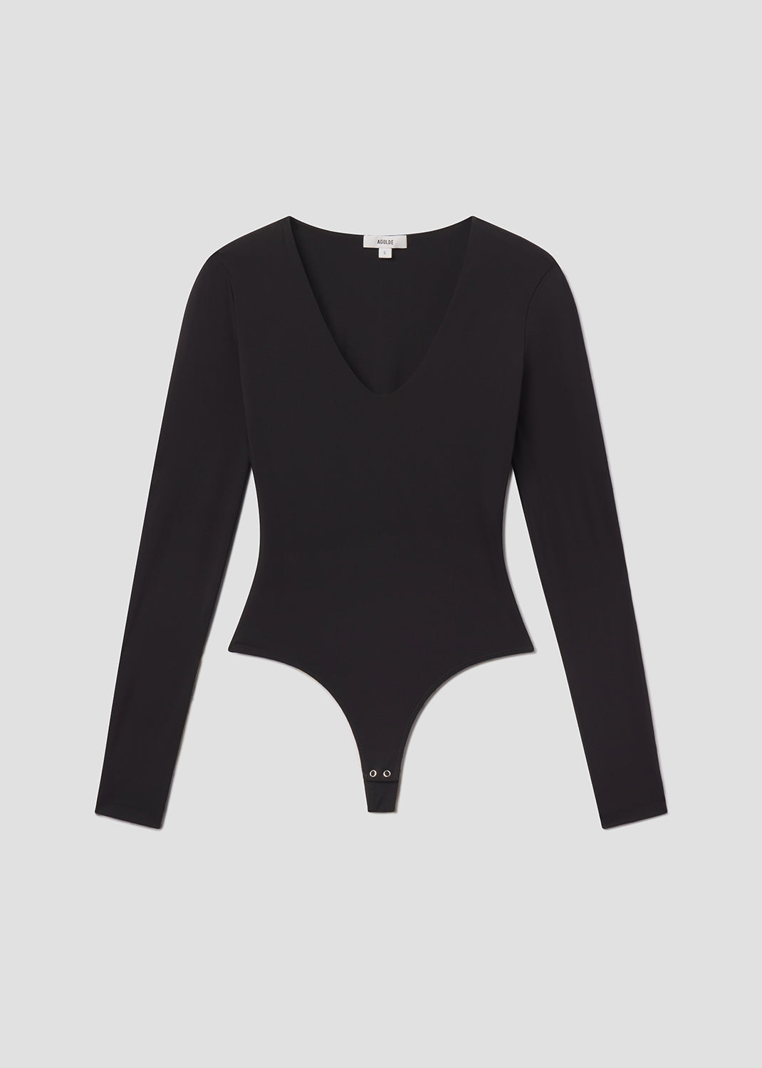 Black bodysuit with long sleeves on a light gray background