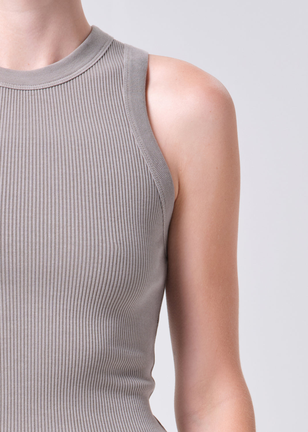 Close-up of a ribbed tank top on a plain background
