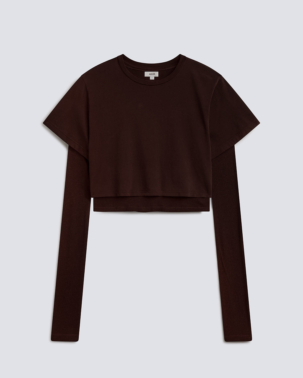 A dark brown cropped long-sleeve top with a short-sleeve overlay, displayed flat against a light gray background.