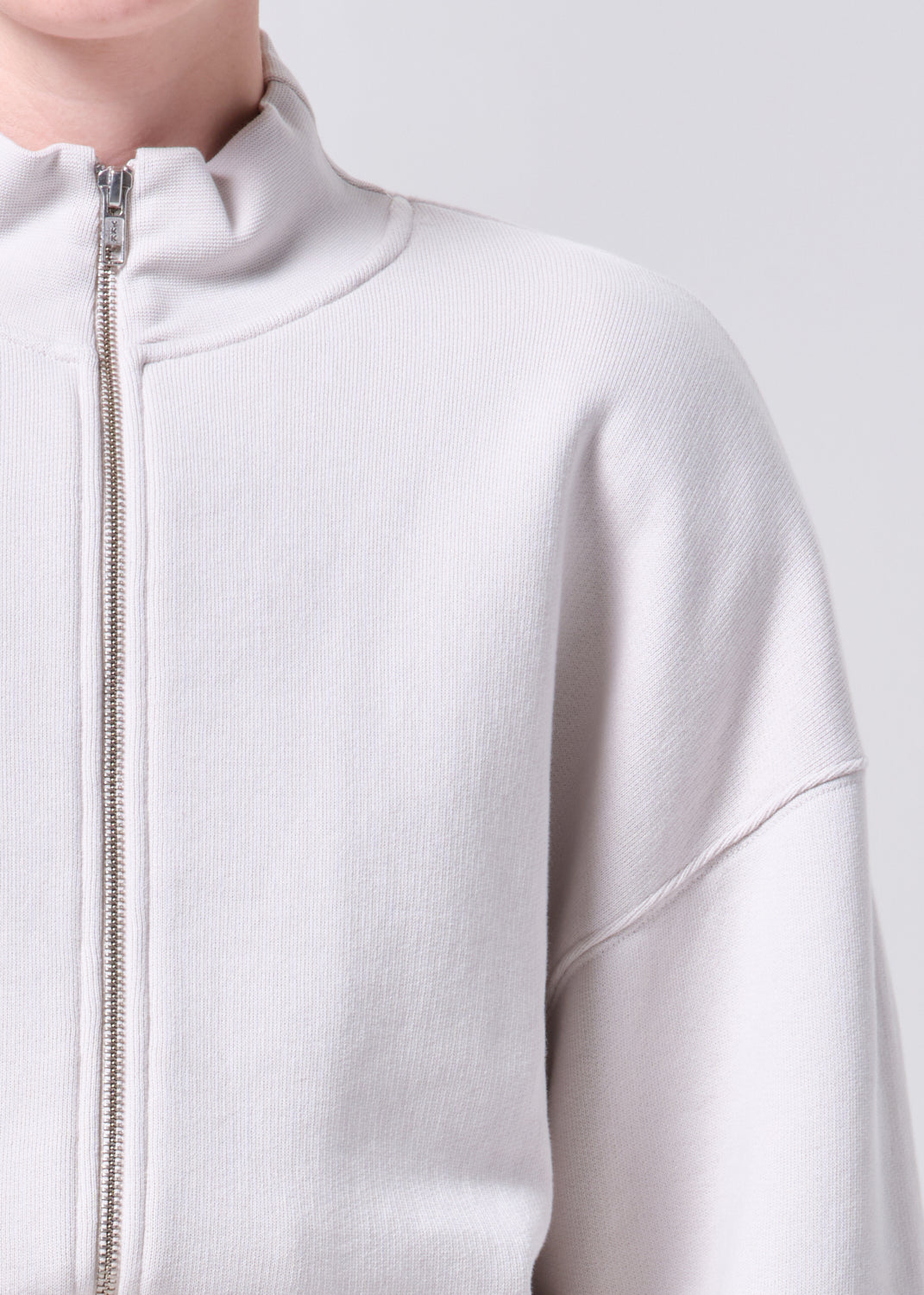 Light gray zip-up hoodie on a white background