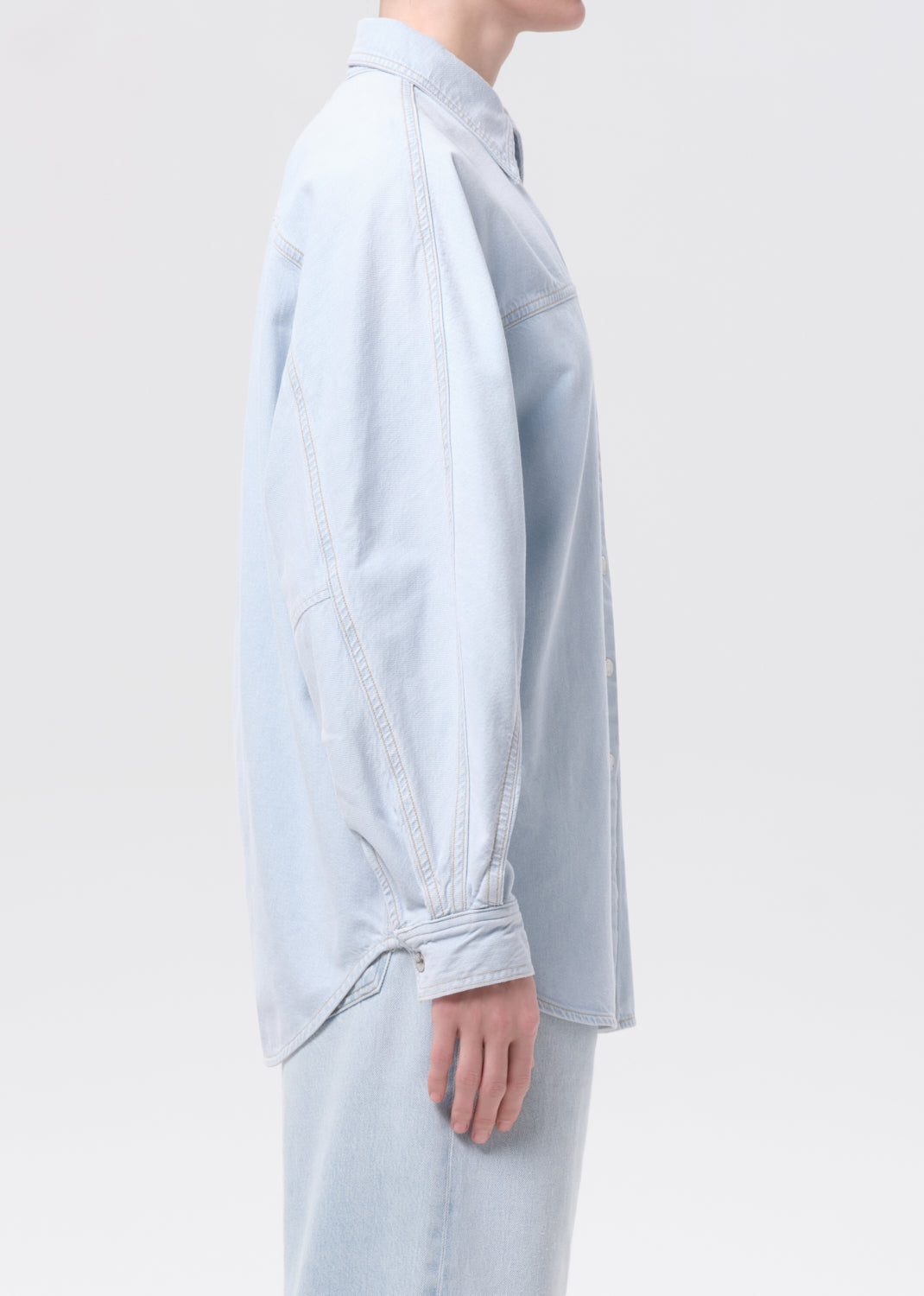 Light blue shirt worn by a person on a white background