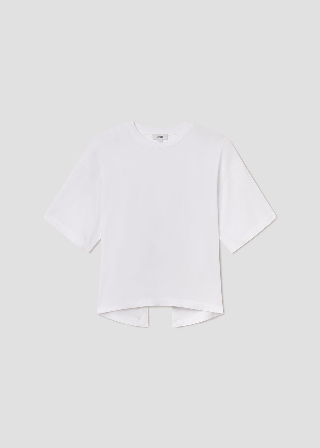 White shirt with a collar on a light gray background