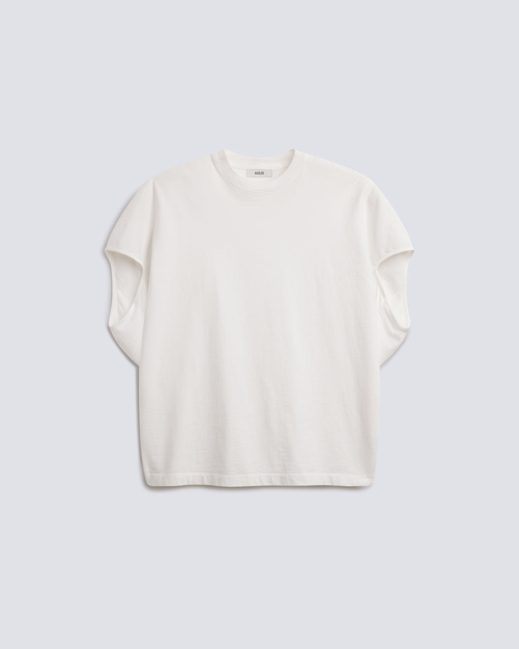 An off-white short-sleeve crewneck t-shirt with a relaxed, oversized fit, displayed flat against a light gray background.