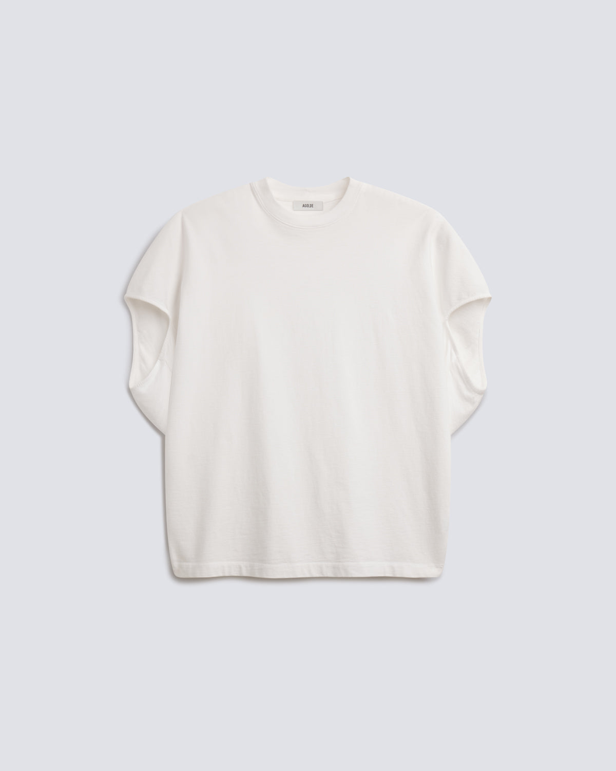 An off-white short-sleeve crewneck t-shirt with a relaxed, oversized fit, displayed flat against a light gray background.
