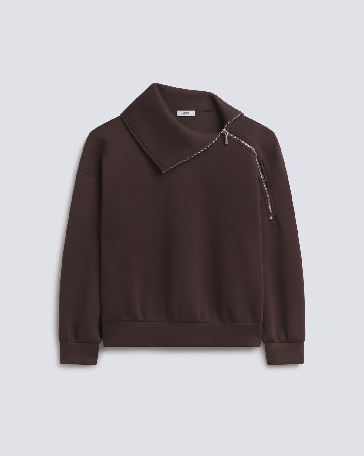 A dark brown long-sleeve sweatshirt with an asymmetrical collar and diagonal zipper detail, displayed on a light gray background.