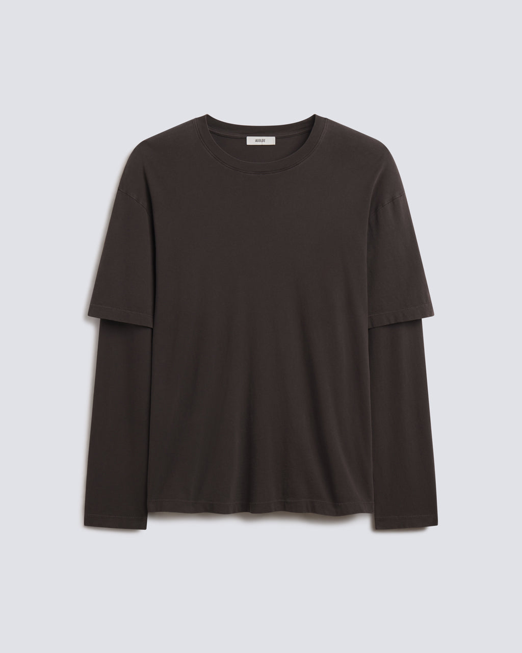 A dark brown long-sleeve crewneck t-shirt with a layered, double-breasted design on the sleeves, shown flat against a light gray background.