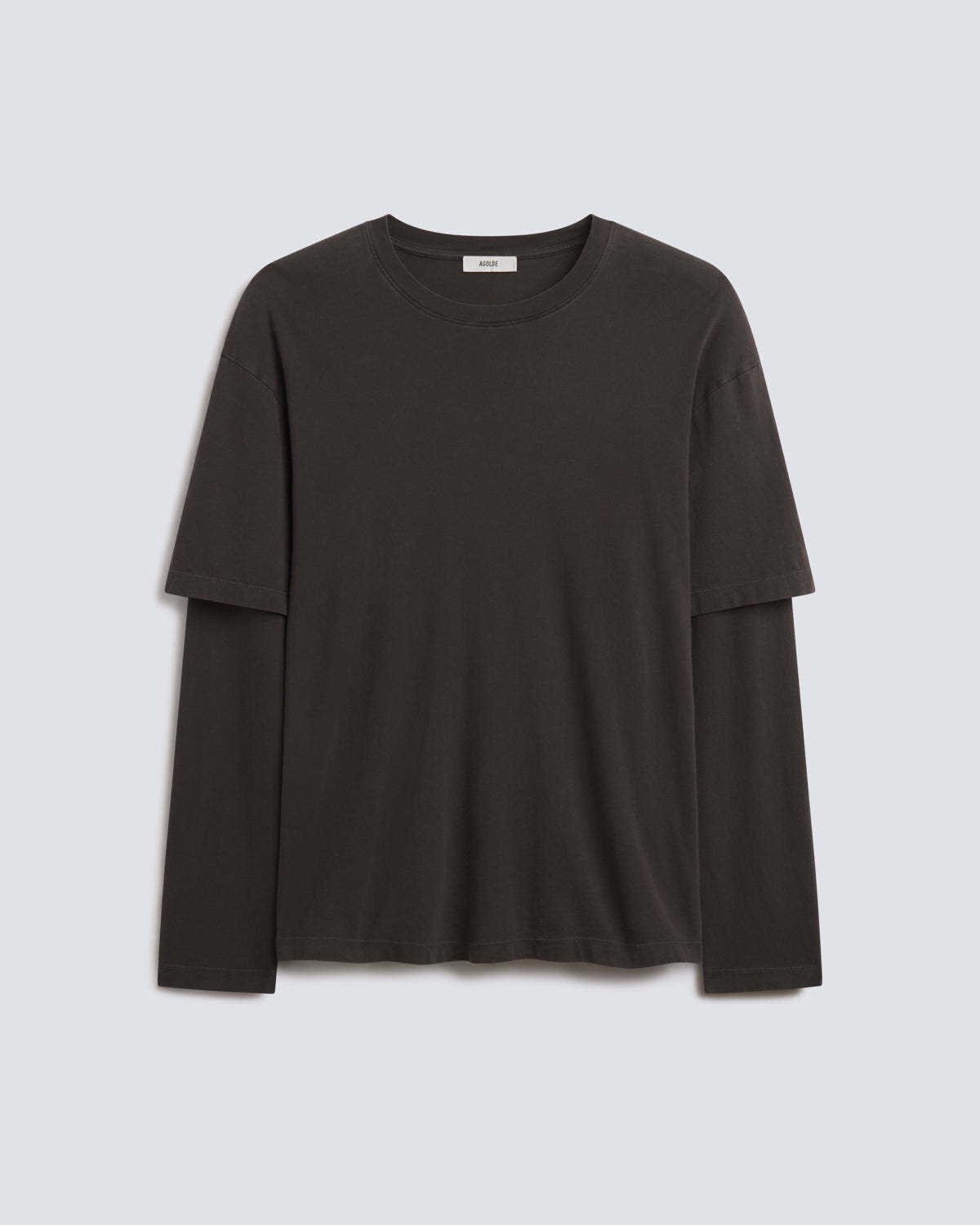 A dark brown long-sleeve crewneck t-shirt with a layered, double-breasted design on the sleeves, shown flat against a light gray background.