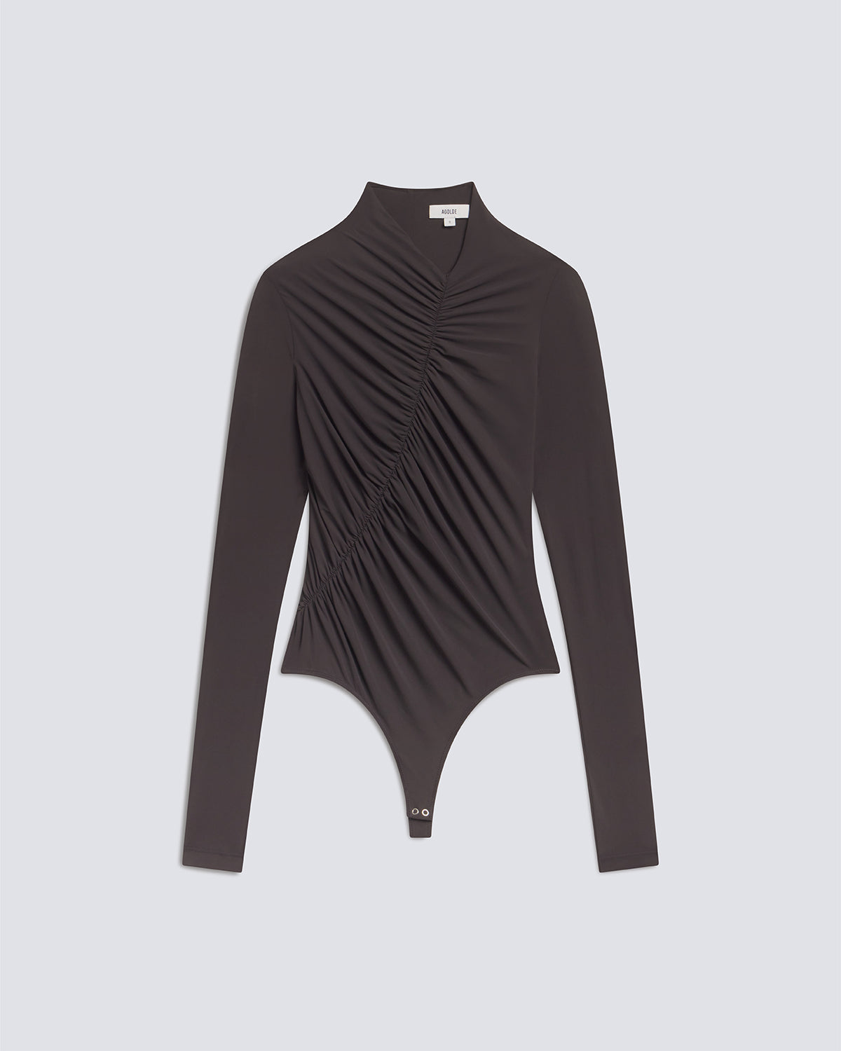 A dark brown long-sleeve bodysuit with dramatic vertical ruching across the chest and waist, displayed on a light gray background.