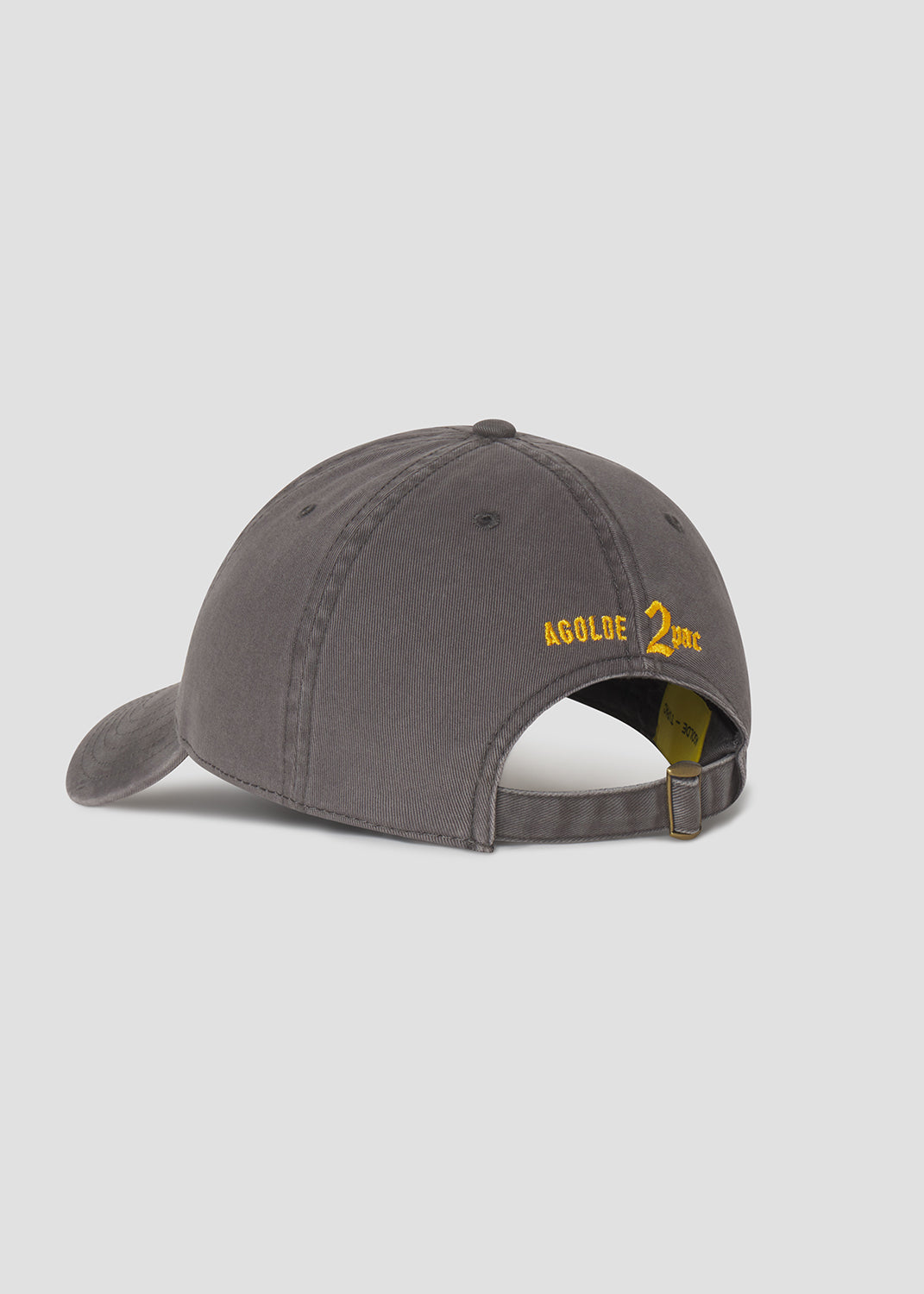 Gray cap with yellow text on a light gray background