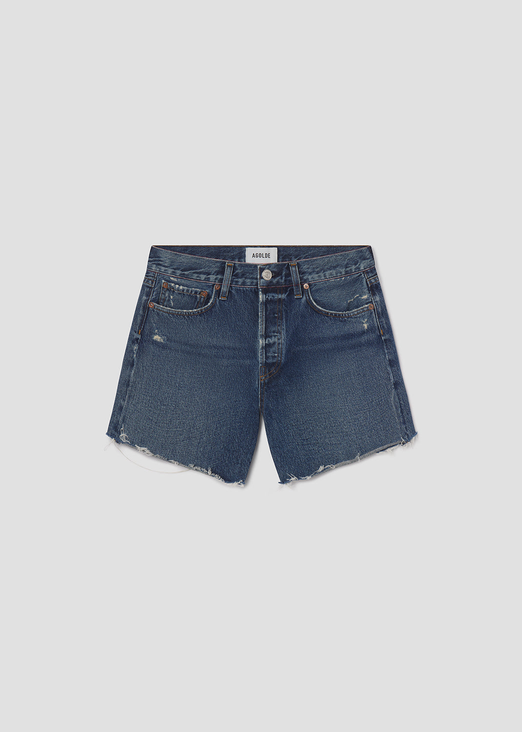 Blue denim shorts on a light gray background