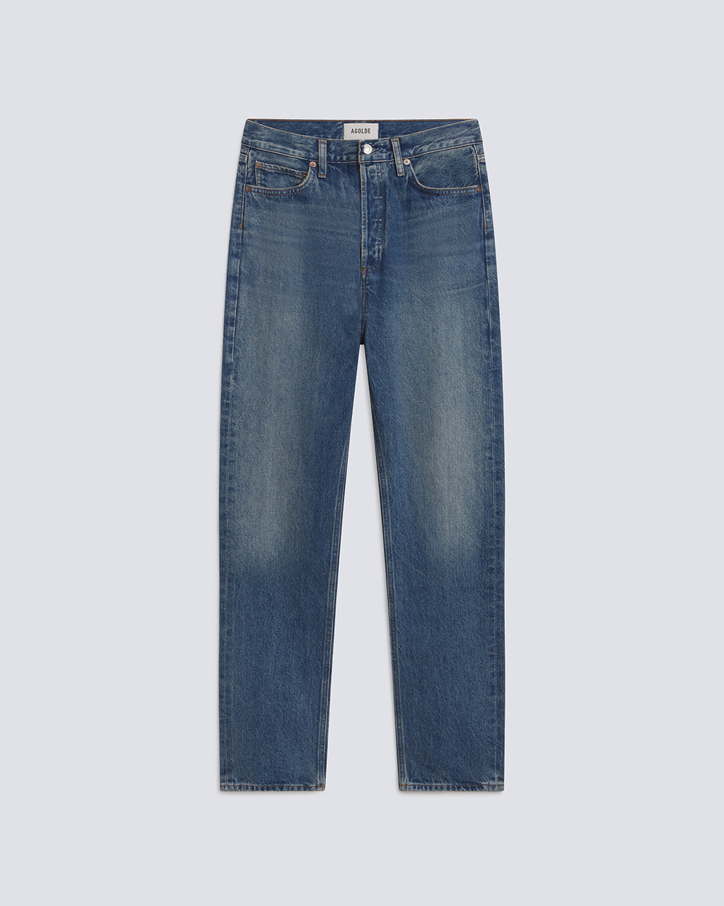 A pair of medium-wash blue denim jeans with subtle fading on the thighs, shown flat against a light gray background.