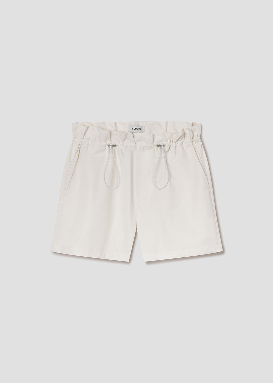 White shorts with drawstring on a light gray background
