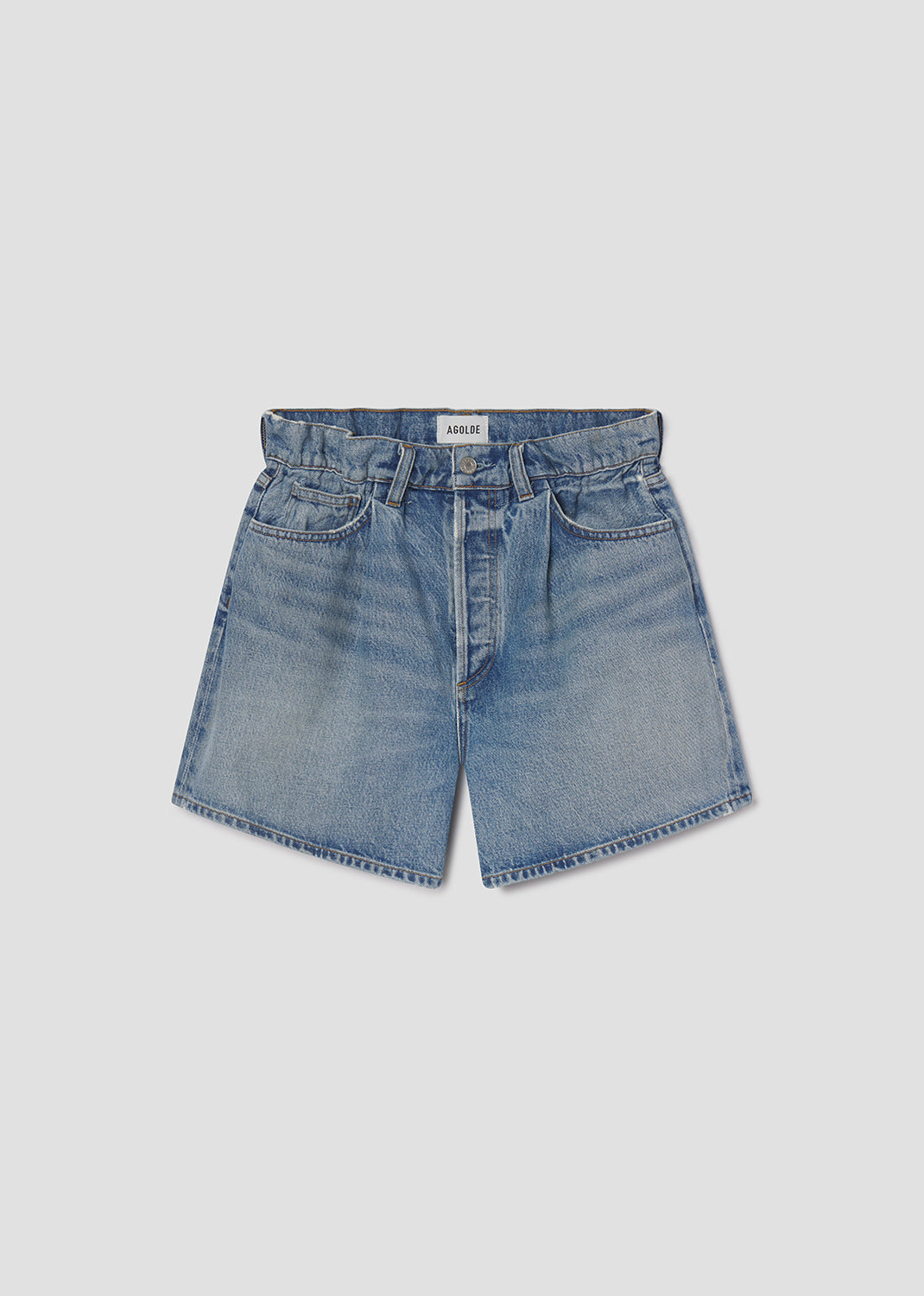 Blue denim shorts on a light gray background